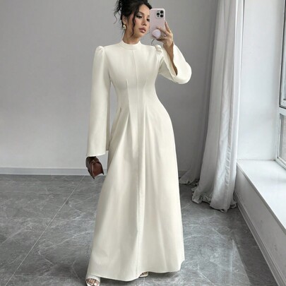 Vestito lungo a maniche lunghe con vita plissettata e gonna ampia