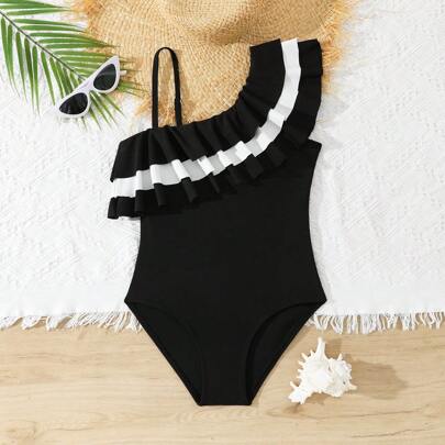 Costume da bagno intero per bambina a balze bianco e nero
